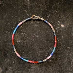 Red and Pink Beaded Bracelet with Gold Clasp